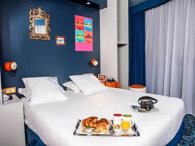 Un ou plusieurs lits dans un hébergement de l'établissement Hotel Gabriel