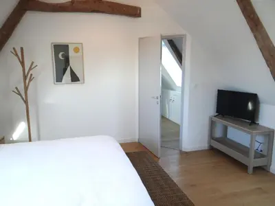 Télévision ou salle de divertissement dans l'établissement La demeure d'Ervée