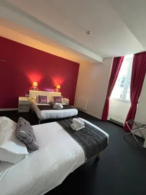 Un ou plusieurs lits dans un hébergement de l'établissement Hôtel - Restaurant Eugenie