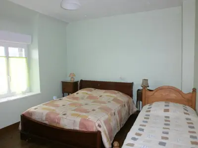 Un ou plusieurs lits dans un hébergement de l'établissement Ferme de la Ruette
