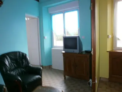 Télévision ou salle de divertissement dans l'établissement Ferme de la Ruette