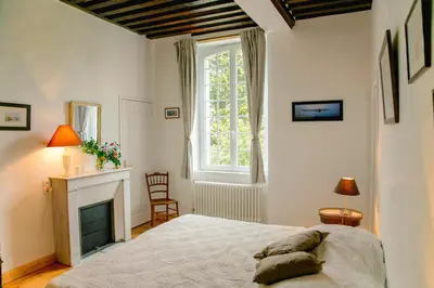 Un ou plusieurs lits dans un hébergement de l'établissement Bed & Breakfast Chateau Les Cèdres
