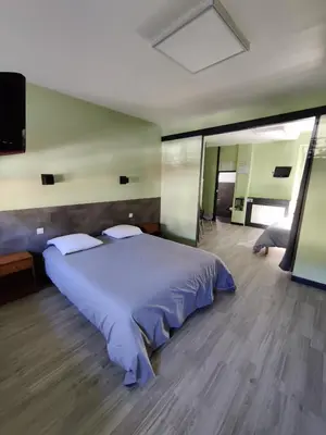 Un ou plusieurs lits dans un hébergement de l'établissement Hôtel Saint - Pierre