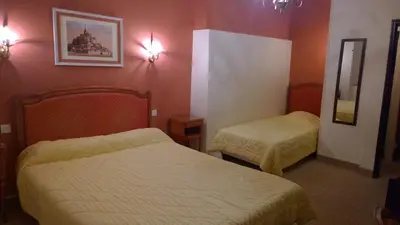Un ou plusieurs lits dans un hébergement de l'établissement Hôtel Saint - Pierre