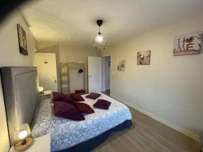 Un ou plusieurs lits dans un hébergement de l'établissement La Villa Port Winston - Face Mer Chambres & Studios