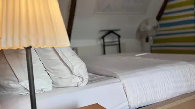 Un ou plusieurs lits dans un hébergement de l'établissement Chambre Centre Ville de Bayeux