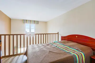 Un ou plusieurs lits dans un hébergement de l'établissement Residence Port Guillaume - maeva Home