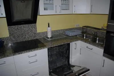 Cuisine ou kitchenette dans l'établissement Gîte Caribou proche Mont Saint Michel