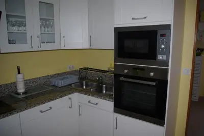 Cuisine ou kitchenette dans l'établissement Gîte Caribou proche Mont Saint Michel