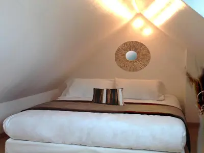 Un ou plusieurs lits dans un hébergement de l'établissement APPART'HOTEL61 Comme à la maison au Cœur de la Normandie