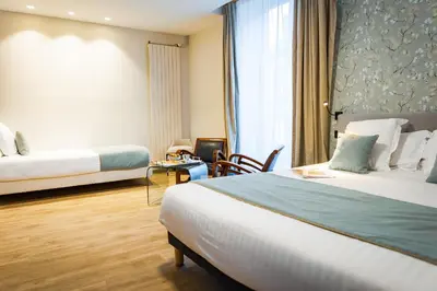 Un ou plusieurs lits dans un hébergement de l'établissement Grand Hôtel du Luxembourg & Spa