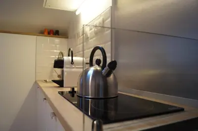 Cuisine ou kitchenette dans l'établissement L'atelier