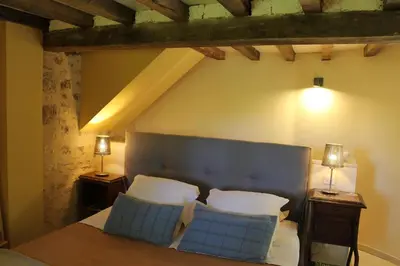 Un ou plusieurs lits dans un hébergement de l'établissement Ferme-Château de Cordey & Spa
