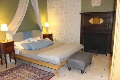 Un ou plusieurs lits dans un hébergement de l'établissement Ferme-Château de Cordey & Spa