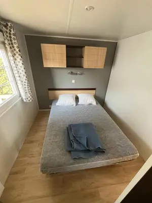 Un ou plusieurs lits dans un hébergement de l'établissement Camping De Collignon