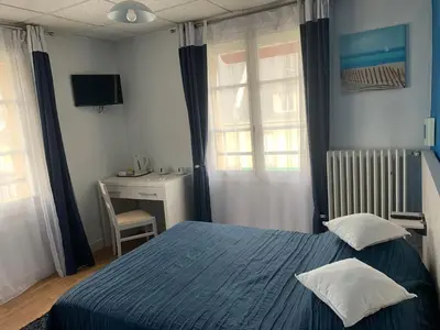 Un ou plusieurs lits dans un hébergement de l'établissement Au Vieux Puits