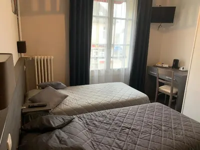 Un ou plusieurs lits dans un hébergement de l'établissement Au Vieux Puits