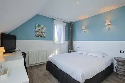 Un ou plusieurs lits dans un hébergement de l'établissement Manoir'Hastings