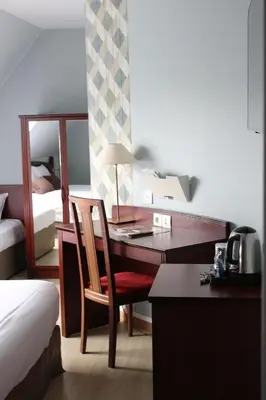 Un ou plusieurs lits dans un hébergement de l'établissement Hôtel Crocus Caen Mémorial