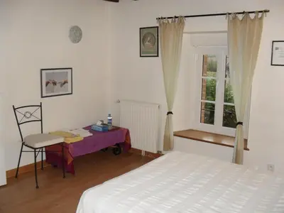 Un ou plusieurs lits dans un hébergement de l'établissement Chambres d'hôtes Au Hameau