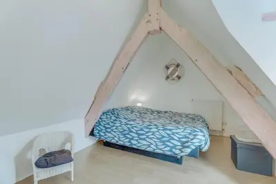 Un ou plusieurs lits dans un hébergement de l'établissement LEPETIT NID DU MONT Maison normande proche de la baie du Mont Saint Michel