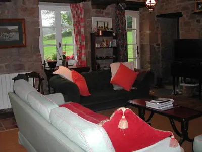 Coin salon dans l'établissement L'Auvraire B&B