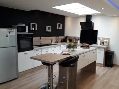 Cuisine ou kitchenette dans l'établissement Gite familial à Carentan