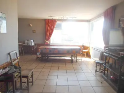 Coin salon dans l'établissement Maison spacieuse avec vue sur la mer à Arromanches-les-Bains