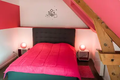Un ou plusieurs lits dans un hébergement de l'établissement bayeux maison pierre 3 chambres