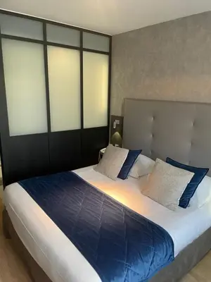 Un ou plusieurs lits dans un hébergement de l'établissement Hotel Best Western La Mare Ô Poissons