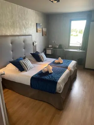 Un ou plusieurs lits dans un hébergement de l'établissement Hotel Best Western La Mare Ô Poissons