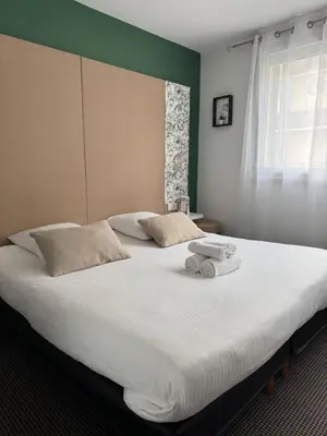 Un ou plusieurs lits dans un hébergement de l'établissement L'Hôtel Bristol