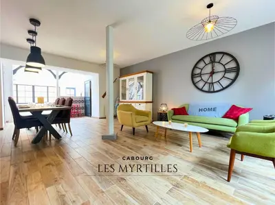 Coin salon dans l'établissement Villa LES MYRTILLES