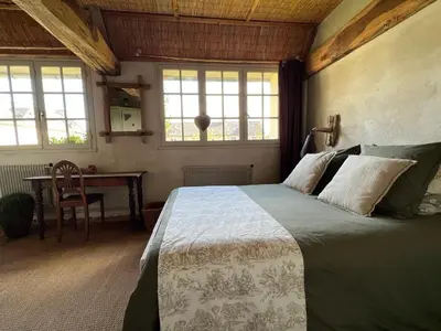 Un ou plusieurs lits dans un hébergement de l'établissement Chambres d'Hôtes Manoir Du Chêne