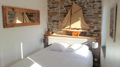 Un ou plusieurs lits dans un hébergement de l'établissement Duplex Terrasse Garage
