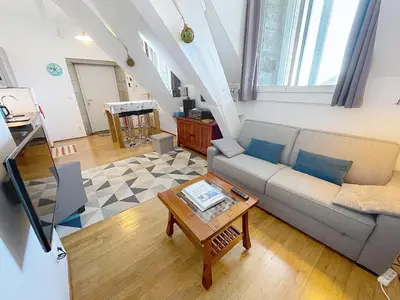 Coin salon dans l'établissement Appartement cosy, 200m plage, parking privé, WiFi - FR-1-361-18