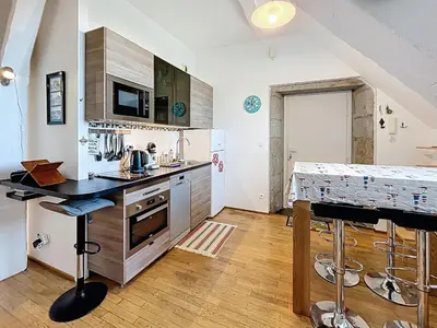 Cuisine ou kitchenette dans l'établissement Appartement cosy, 200m plage, parking privé, WiFi - FR-1-361-18
