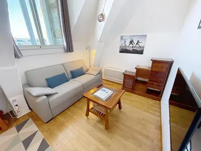 Coin salon dans l'établissement Appartement cosy, 200m plage, parking privé, WiFi - FR-1-361-18