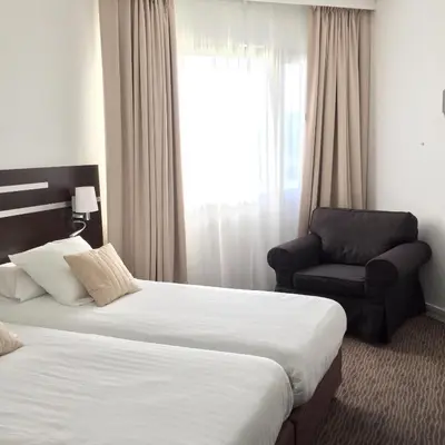 Un ou plusieurs lits dans un hébergement de l'établissement Hotel Chantereyne