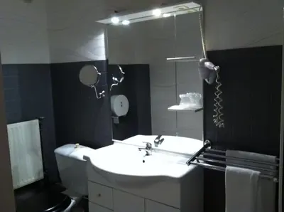 Salle de bains dans l'établissement Le Beverl'inn