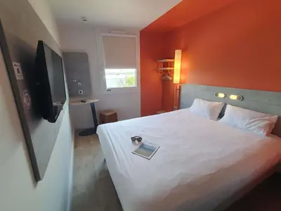 Un ou plusieurs lits dans un hébergement de l'établissement ibis budget Coutances