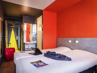 Un ou plusieurs lits dans un hébergement de l'établissement ibis budget Coutances