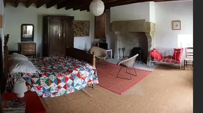 Un ou plusieurs lits dans un hébergement de l'établissement Manoir de la Guerrie