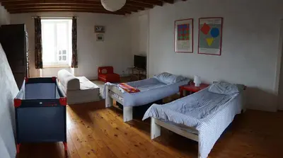 Un ou plusieurs lits dans un hébergement de l'établissement Manoir de la Guerrie