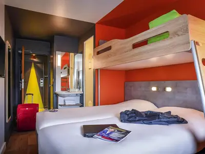 Un ou plusieurs lits dans un hébergement de l'établissement ibis budget Saint Lô