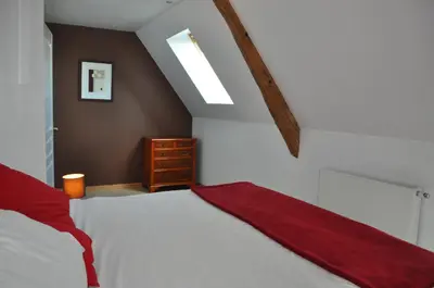 Un ou plusieurs lits dans un hébergement de l'établissement La Maison du Chene