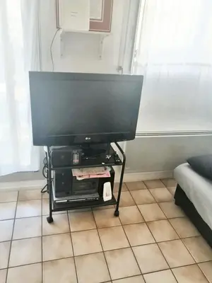 Télévision ou salle de divertissement dans l'établissement Appartement charmant à Cabourg avec piscine partagée (24 m²)