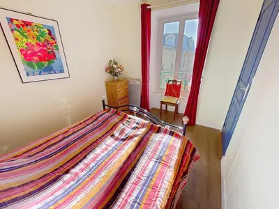 Un ou plusieurs lits dans un hébergement de l'établissement Appartement T2 avec ascenseur, hypercentre, à 50m de la plage, WIFI, TV connectée, linge en option - FR-1-361-4