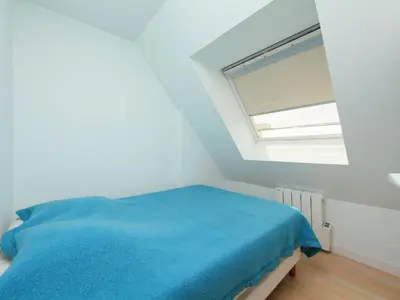 Un ou plusieurs lits dans un hébergement de l'établissement Apartment La Guillaumière-1 by Interhome