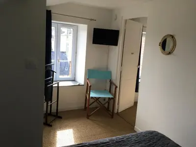 Télévision ou salle de divertissement dans l'établissement Maison de pêcheur